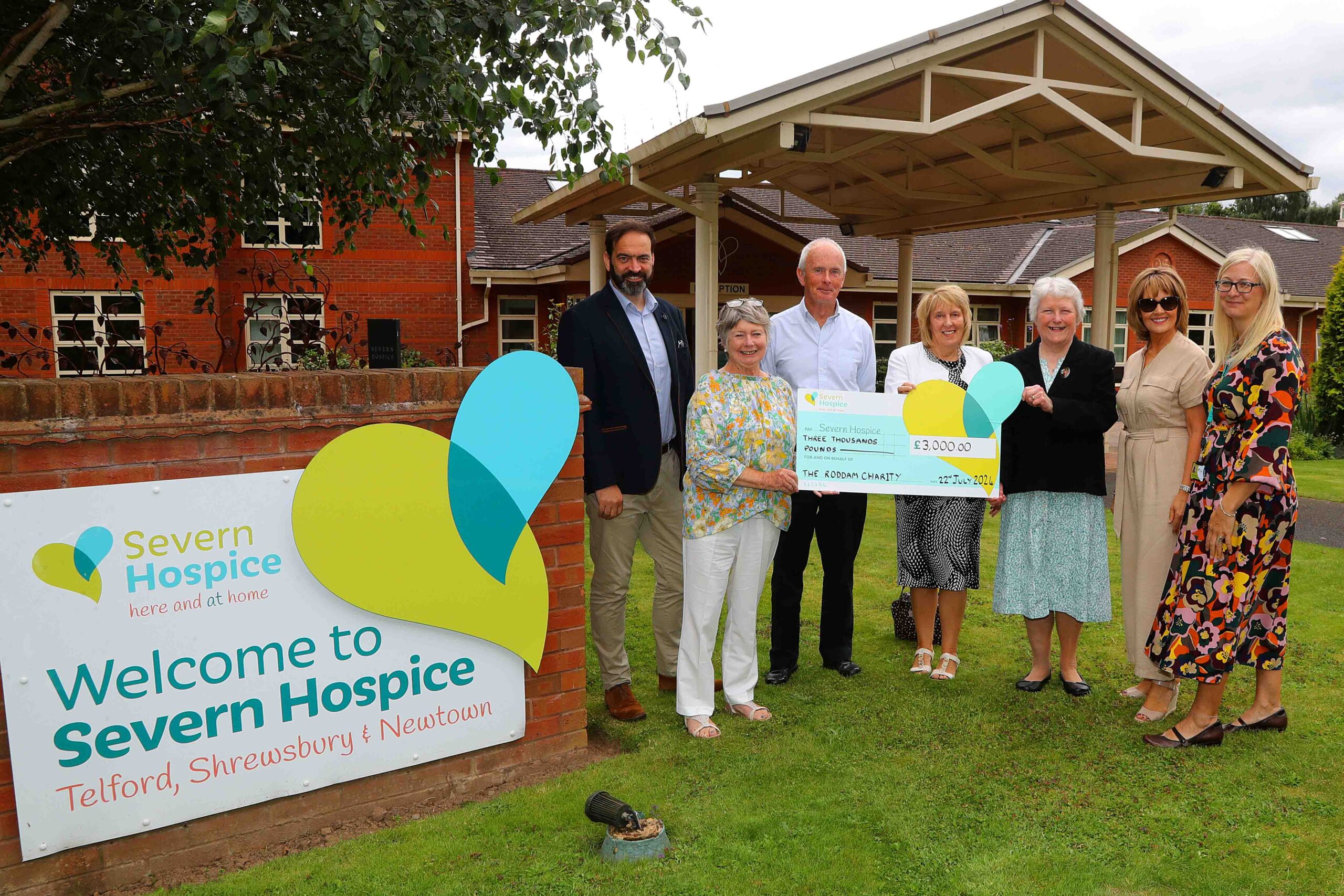 Trustees of The Roddam Charity stand in front of the Telford hospice site with Susie Foster from Severn Hospice.